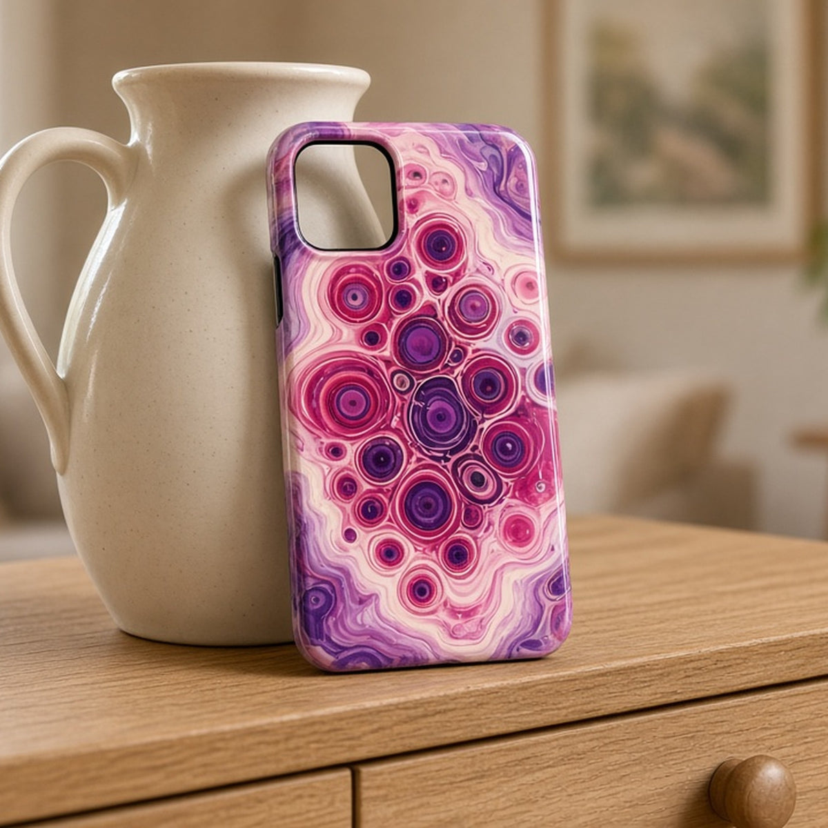 Berry puddle-pour colour target pattern printed flat on a phone case on an oak sideboard, made with prompt #216