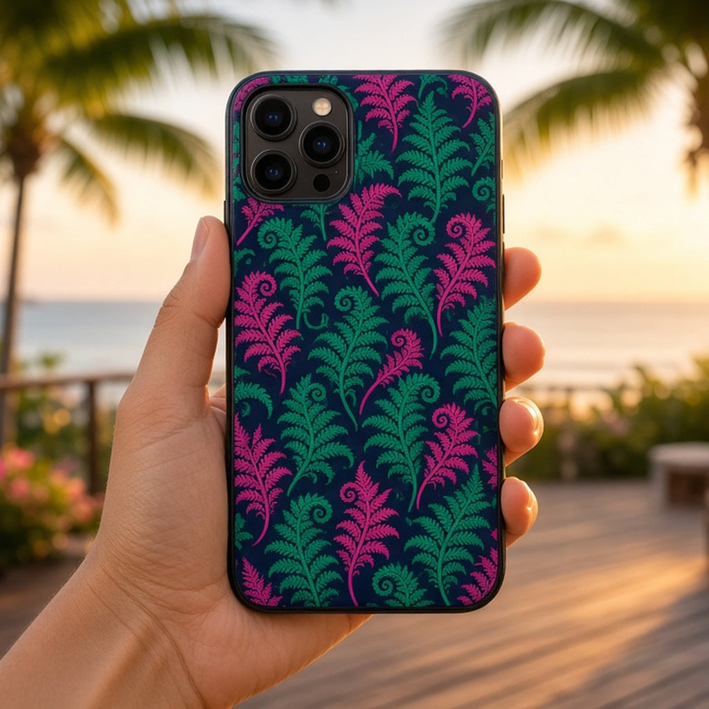 Emerald and fuchsia tree-fern fiddlehead pattern printed flat on a phone case held on a tropical terrace, made with prompt #31