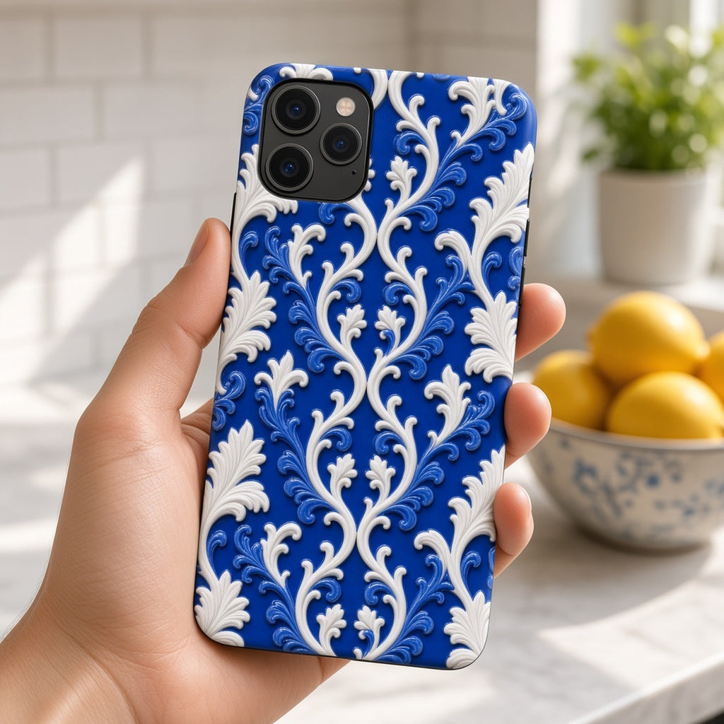 Hand holding a phone in a raised-relief blue and white Victorian filigree ceramic-look case in a sunny kitchen, made with prompt #35
