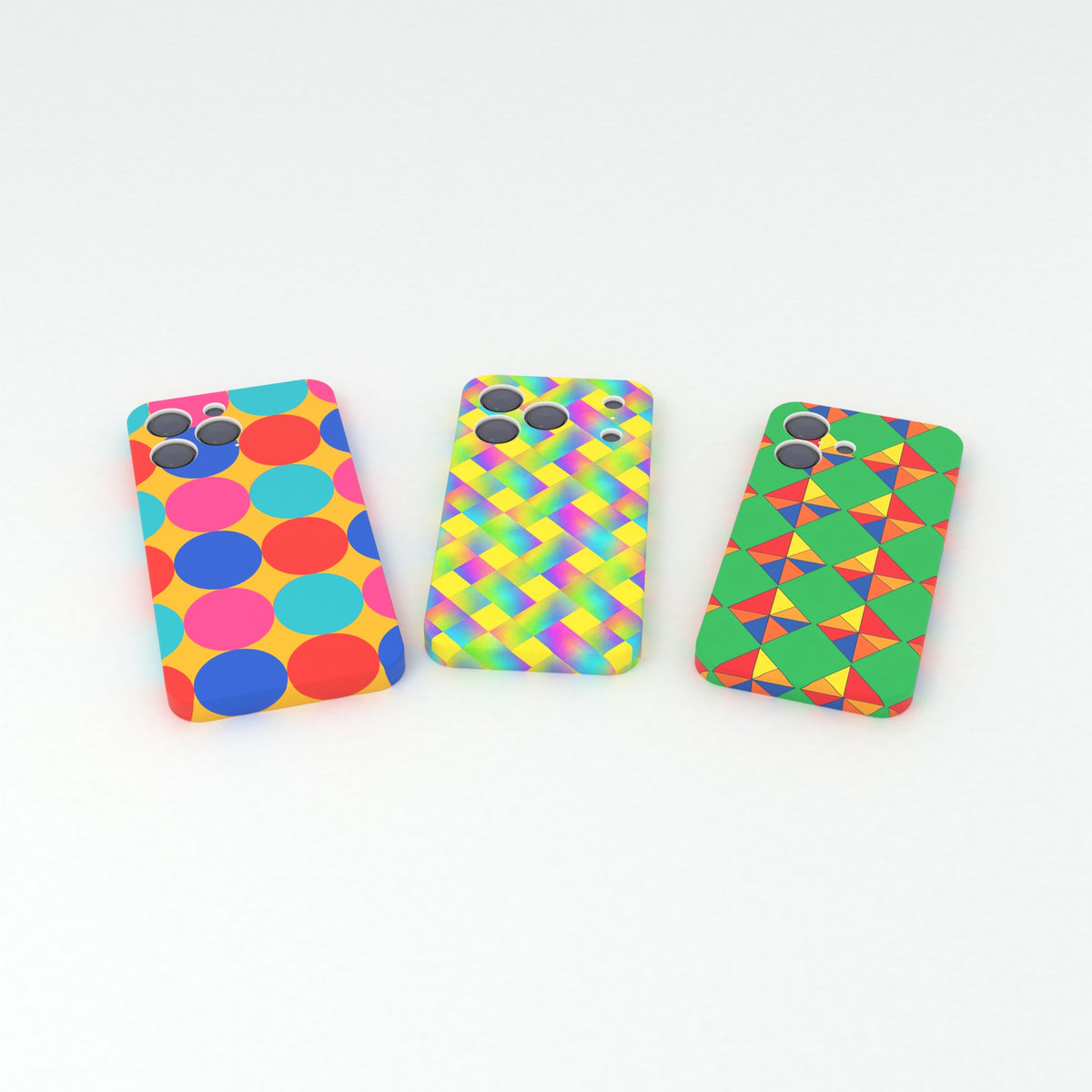 Sublimation wrap-around: three phone cases lying side by side with artwork wrapping round the back and sides, clean camera cut-outs.