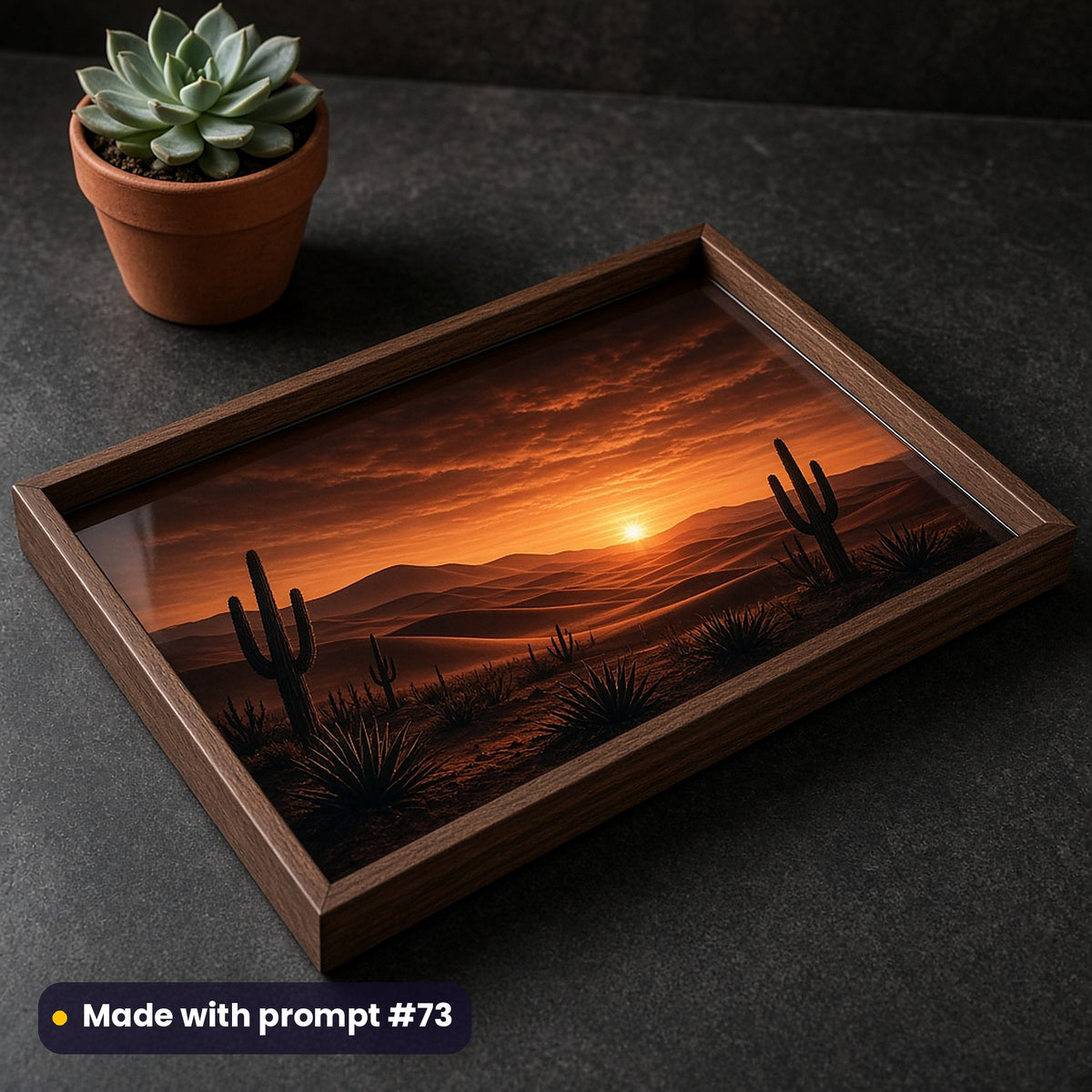 Walnut tray printed with a dark luxury desert dusk of silhouetted cacti and sand dunes under an amber sky, on a charcoal counter beside a succulent, made with prompt #73