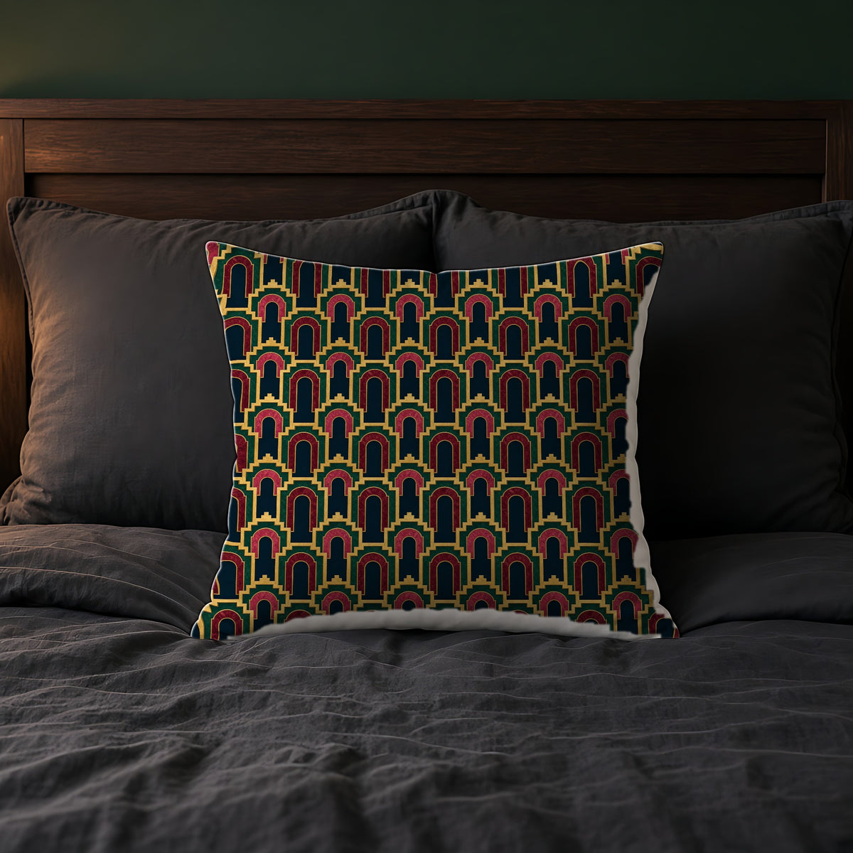 Stepped Gold Arches Faux Suede Cushion on a bed with charcoal bedding