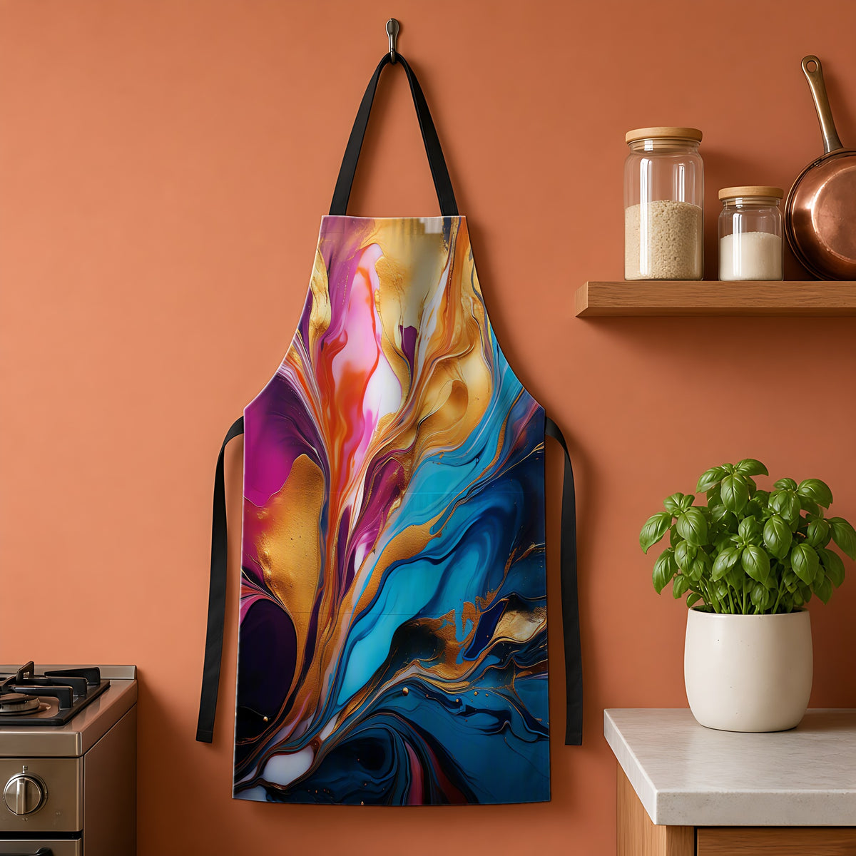 Gilded Fluid Swirl Apron hanging on a terracotta kitchen wall