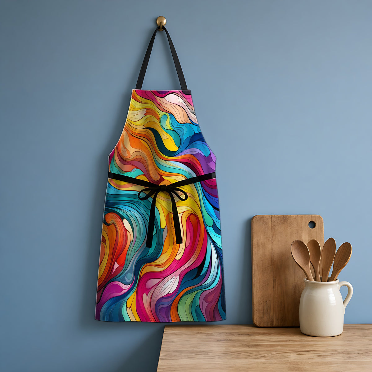 Neon Wave Swirl Apron hanging in a blue kitchen