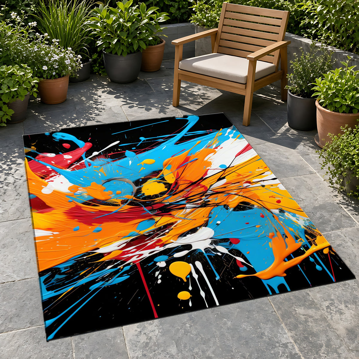 Electric Paint Splash Outdoor Rug on a stone patio with potted plants