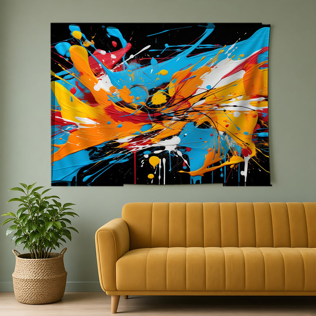 Electric Paint Splash Wall Tapestry hanging above a mustard sofa