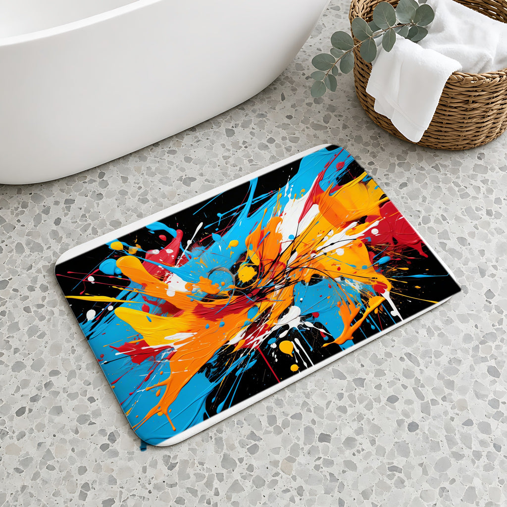 Electric Paint Splash Bath Mat on a terrazzo floor beside a freestanding bath
