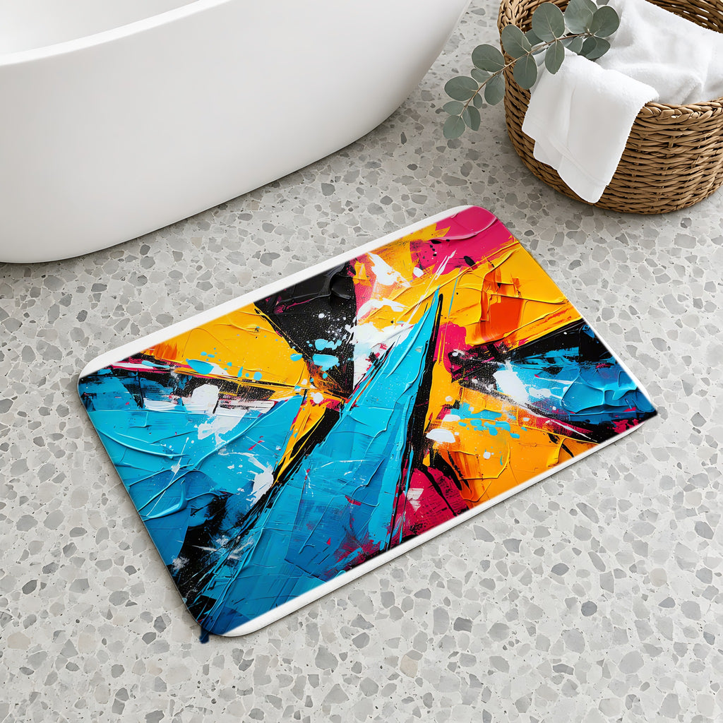 Shattered Blue Burst Bath Mat on a terrazzo floor beside a freestanding bath