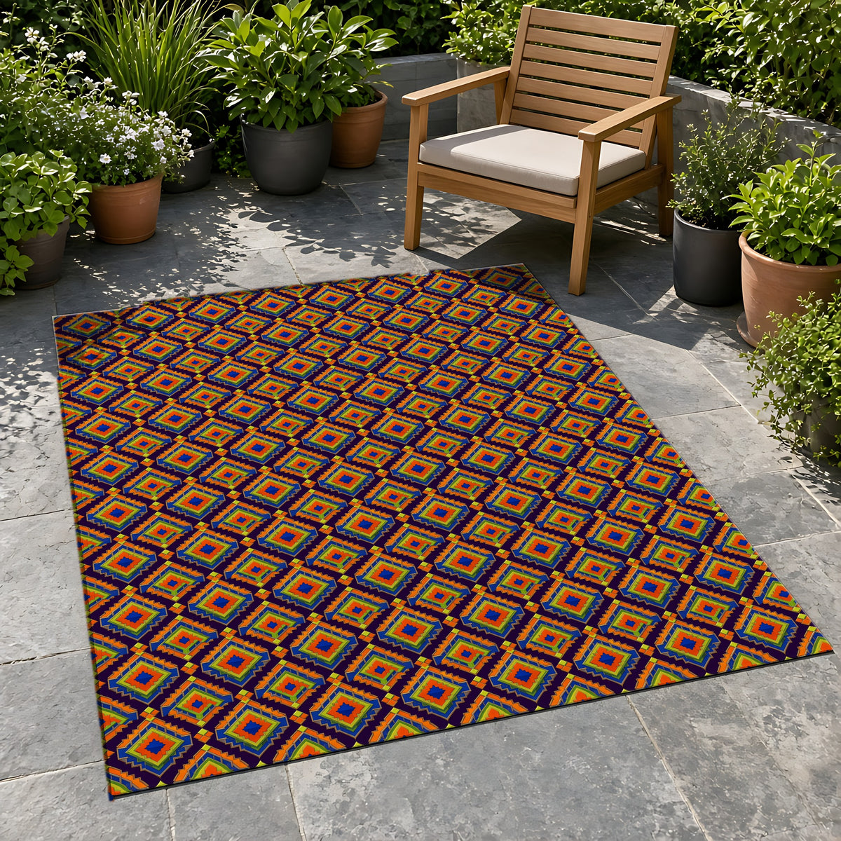 Stepped Diamond Ikat Outdoor Rug on a stone patio with potted plants