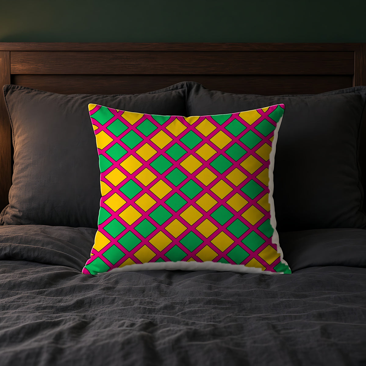 Harlequin Gold Grid Faux Suede Cushion on a bed with charcoal bedding