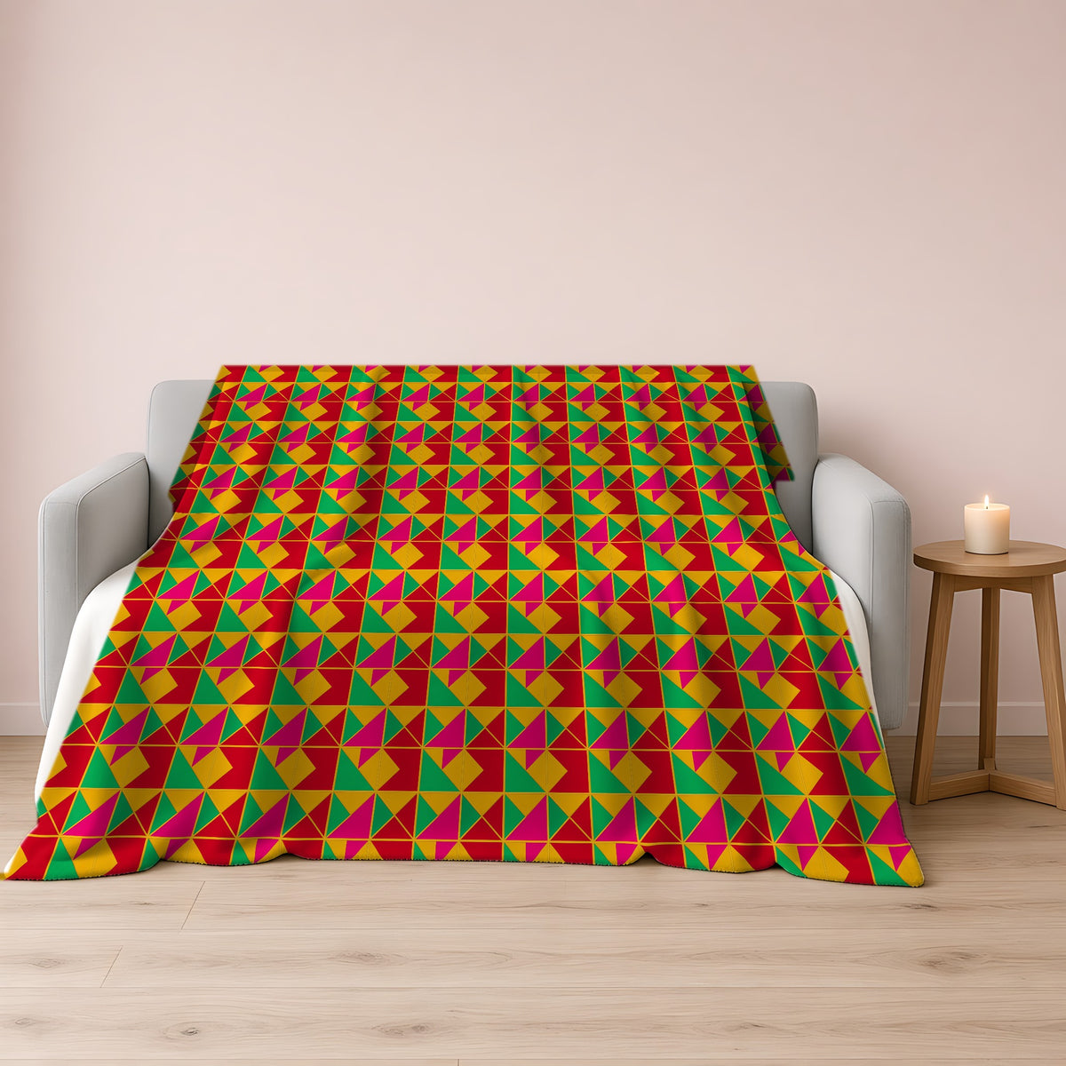 Jewel Block Quilt Sherpa Fleece Blanket draped over a grey sofa
