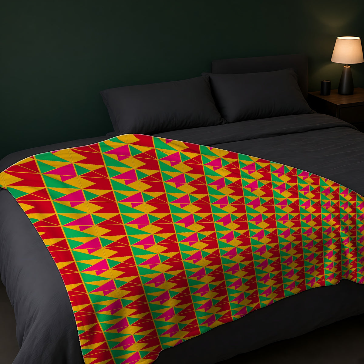 Jewel Block Quilt Sherpa Fleece Blanket across the foot of a dark bed