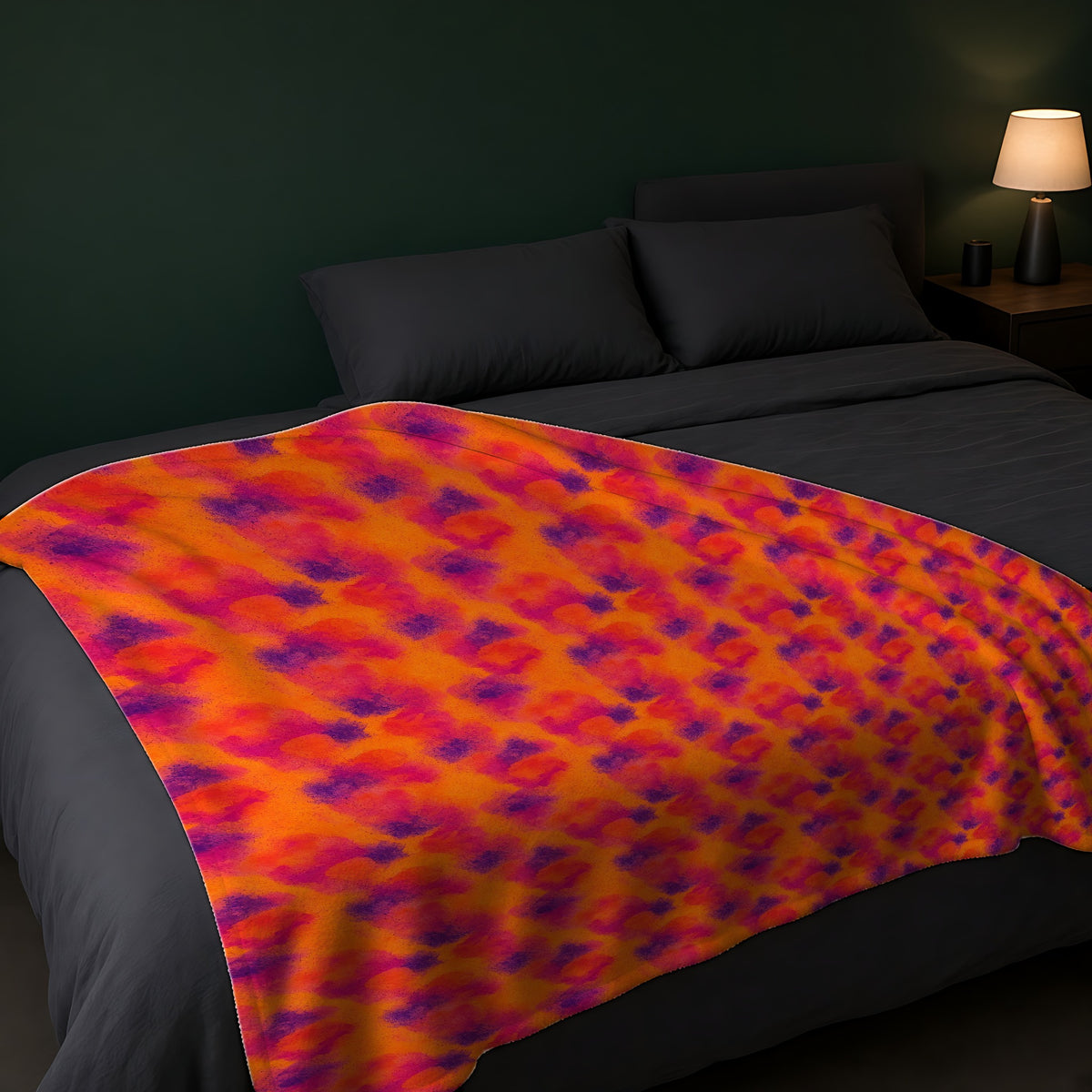Granulated Colour Pools Sherpa Fleece Blanket across the foot of a dark bed