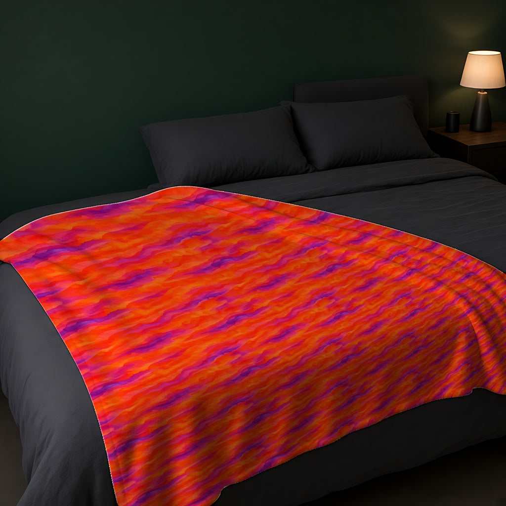 Wash Ribbon Drift Sherpa Fleece Blanket across the foot of a dark bed