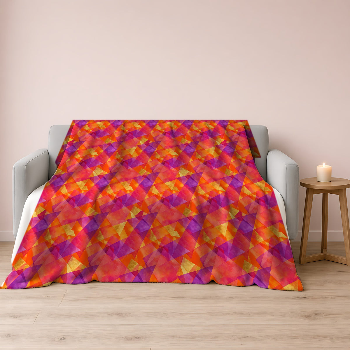 Layered Wash Shards Sherpa Fleece Blanket draped over a grey sofa