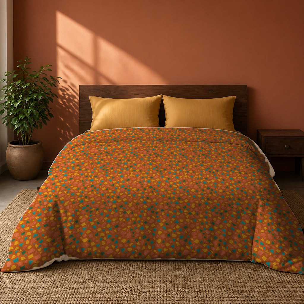 Angular Shard Scatter Comforter on a king bed against a warm terracotta wall