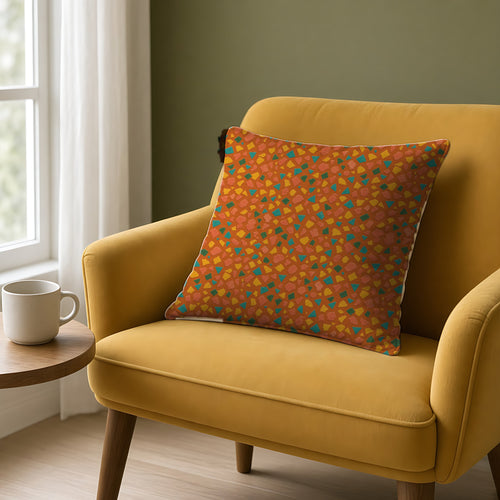 Angular Shard Scatter Faux Suede Cushion on a mustard armchair by a window