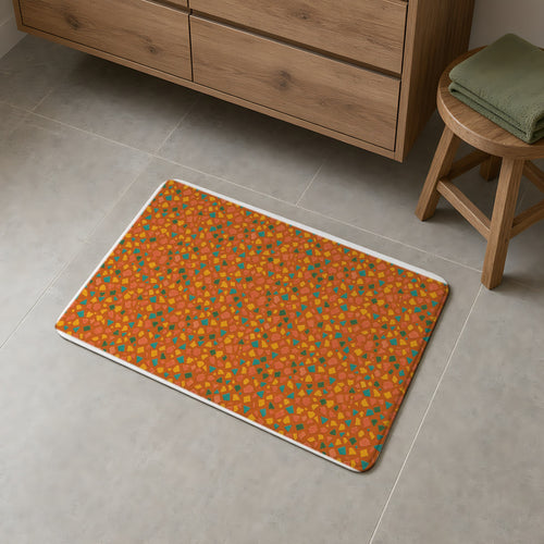 Angular Shard Scatter Bath Mat on a grey tiled bathroom floor