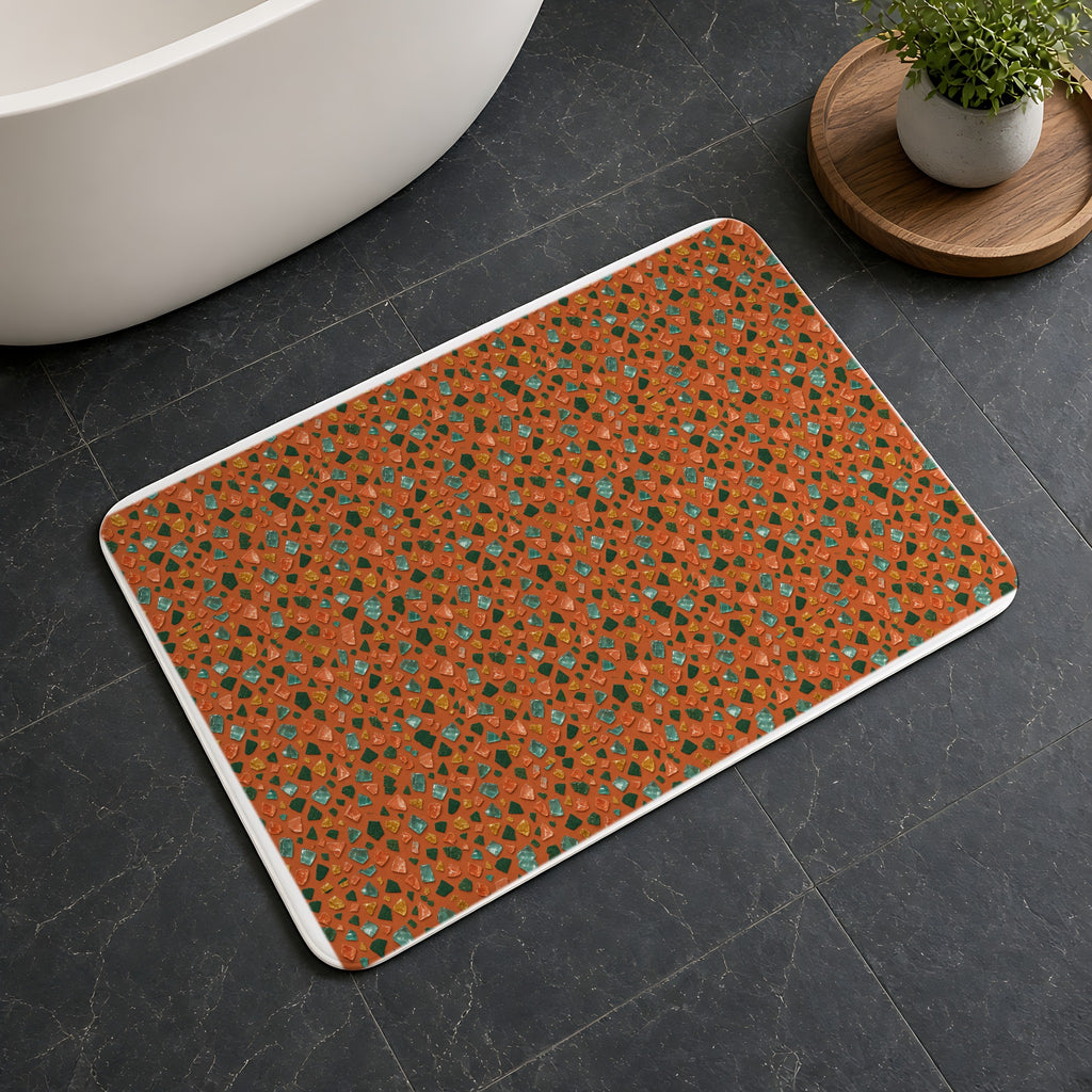 Glass Chip Sheen Bath Mat on a dark slate floor beside a bath
