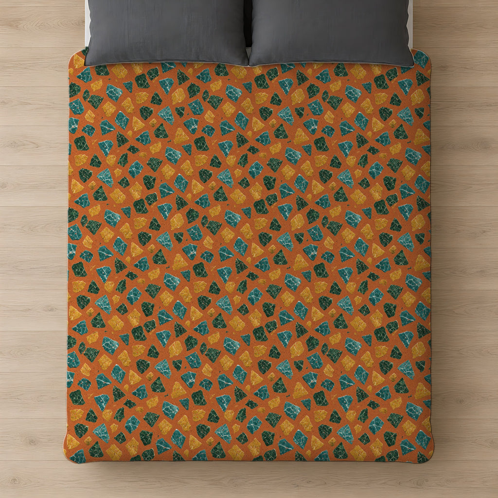 Marble Fragment Toss Comforter on a bed, seen from above