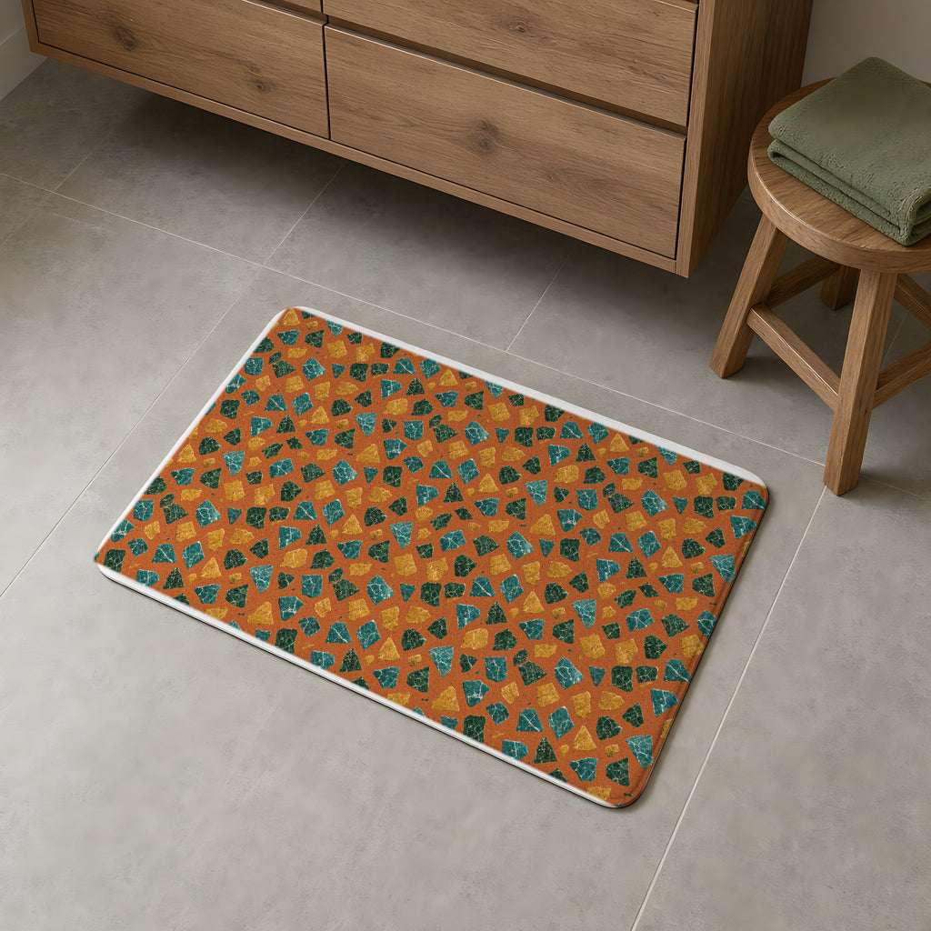 Marble Fragment Toss Bath Mat on a grey tiled bathroom floor