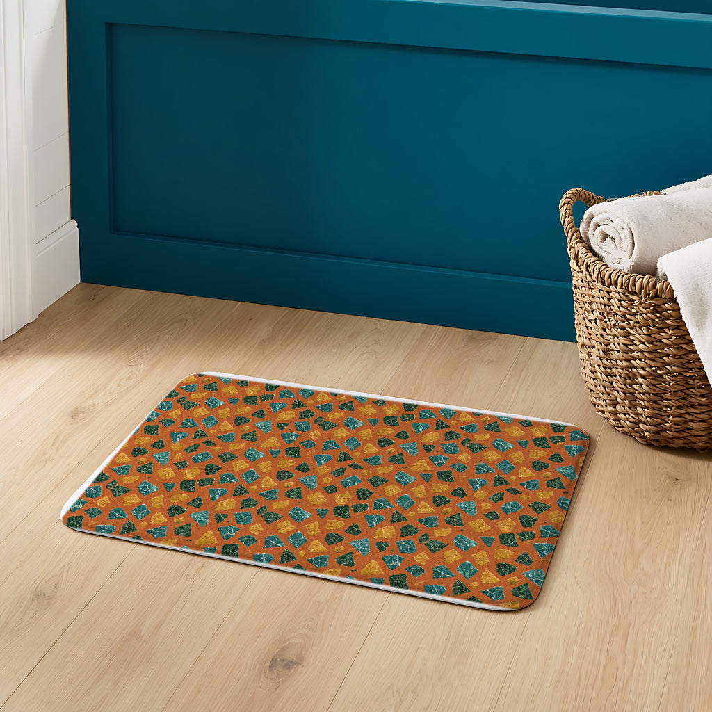 Marble Fragment Toss Bath Mat on an oak floor in a teal bathroom