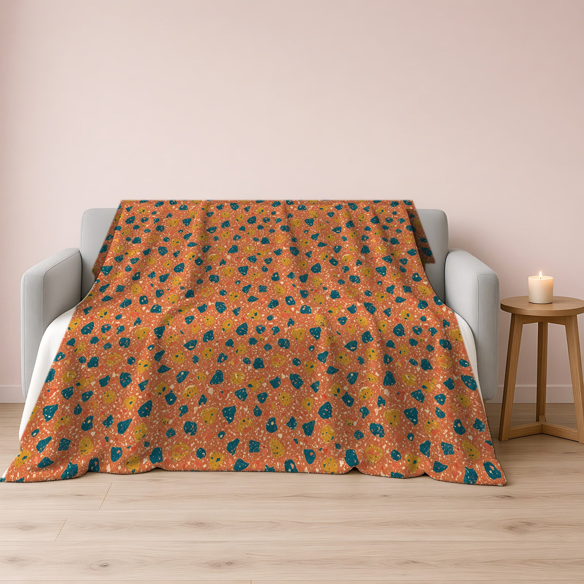 Two-Scale Chips Sherpa Fleece Blanket draped over a grey sofa