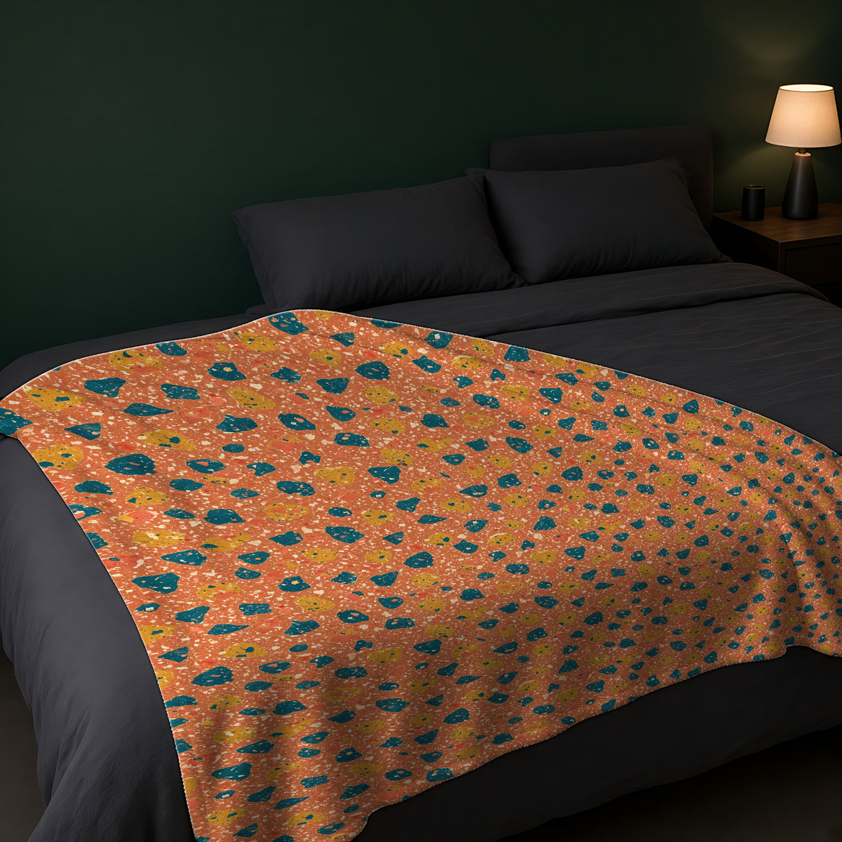 Two-Scale Chips Sherpa Fleece Blanket across the foot of a dark bed