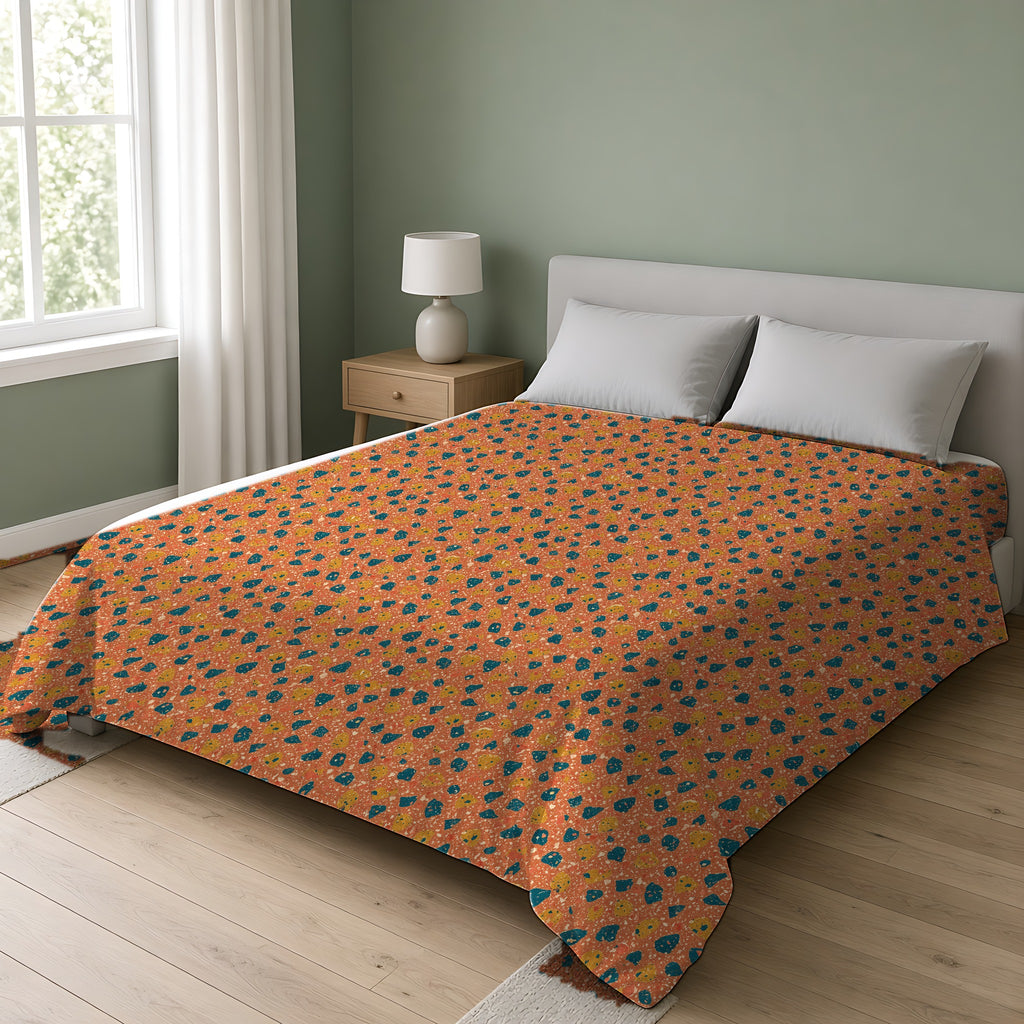 Two-Scale Chips Comforter on a double bed in a bright sage-green bedroom