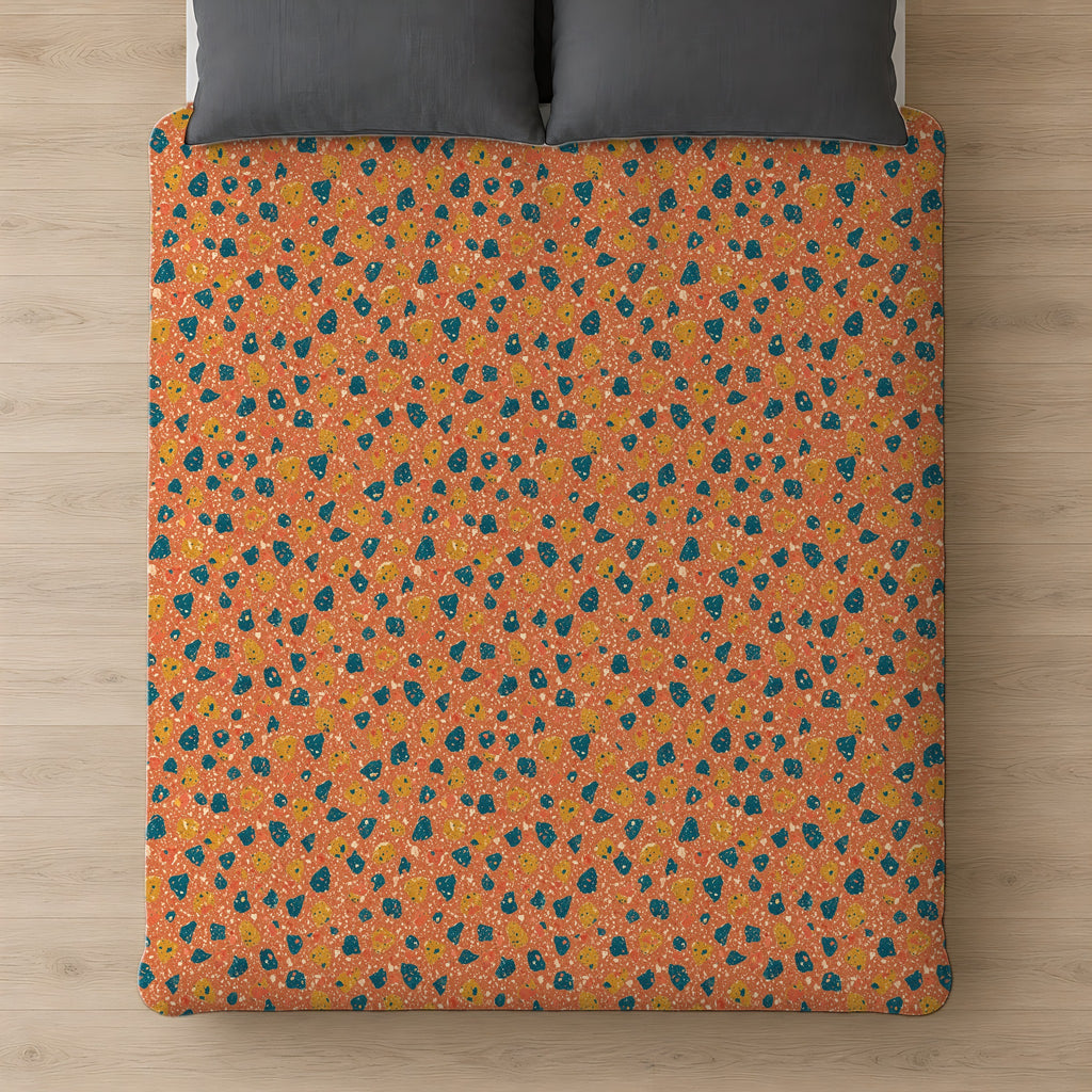 Two-Scale Chips Comforter on a bed, seen from above