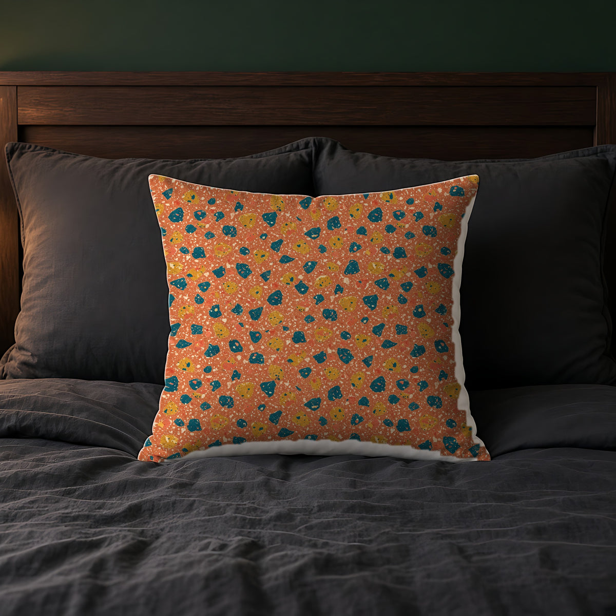Two-Scale Chips Faux Suede Cushion on a bed with charcoal bedding