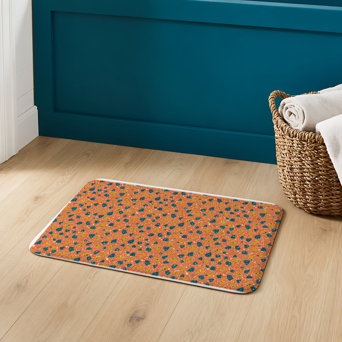 Two-Scale Chips Bath Mat on an oak floor in a teal bathroom