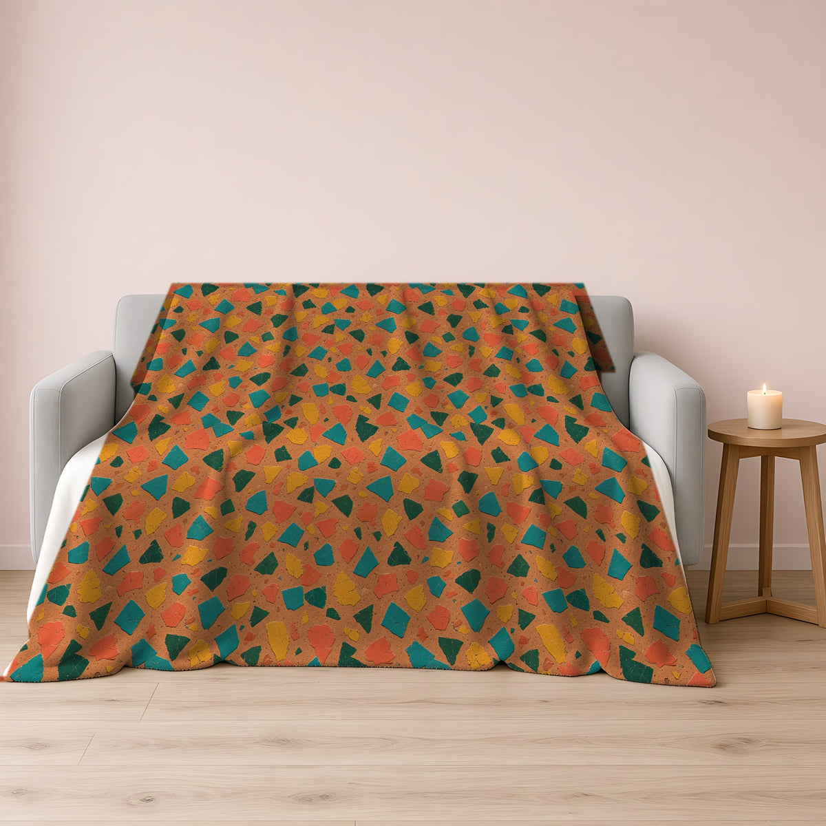 Shattered Tile Shards Sherpa Fleece Blanket draped over a grey sofa