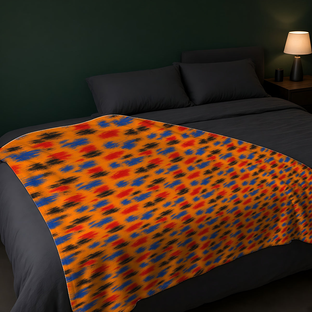 Dry-Brush Drags Sherpa Fleece Blanket across the foot of a dark bed