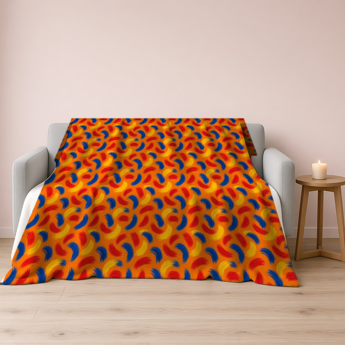Sweeping Arcs Sherpa Fleece Blanket draped over a grey sofa