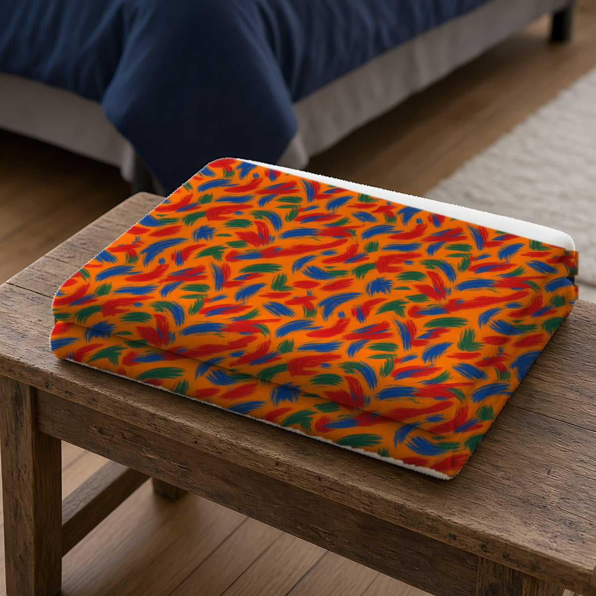 Layered Gesture Scribbles Sherpa Fleece Blanket folded on a wooden bench