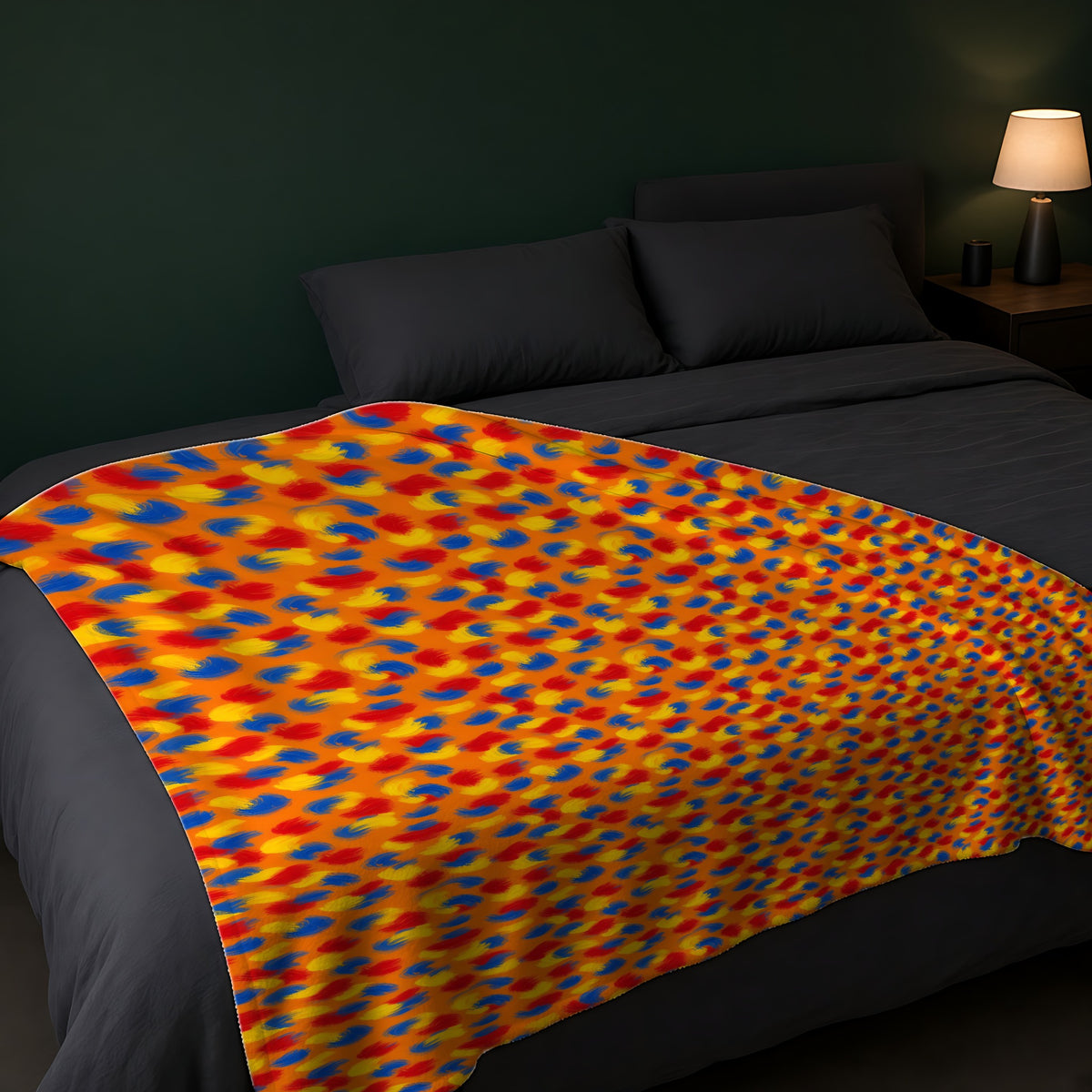 Wet Stroke Blends Sherpa Fleece Blanket across the foot of a dark bed