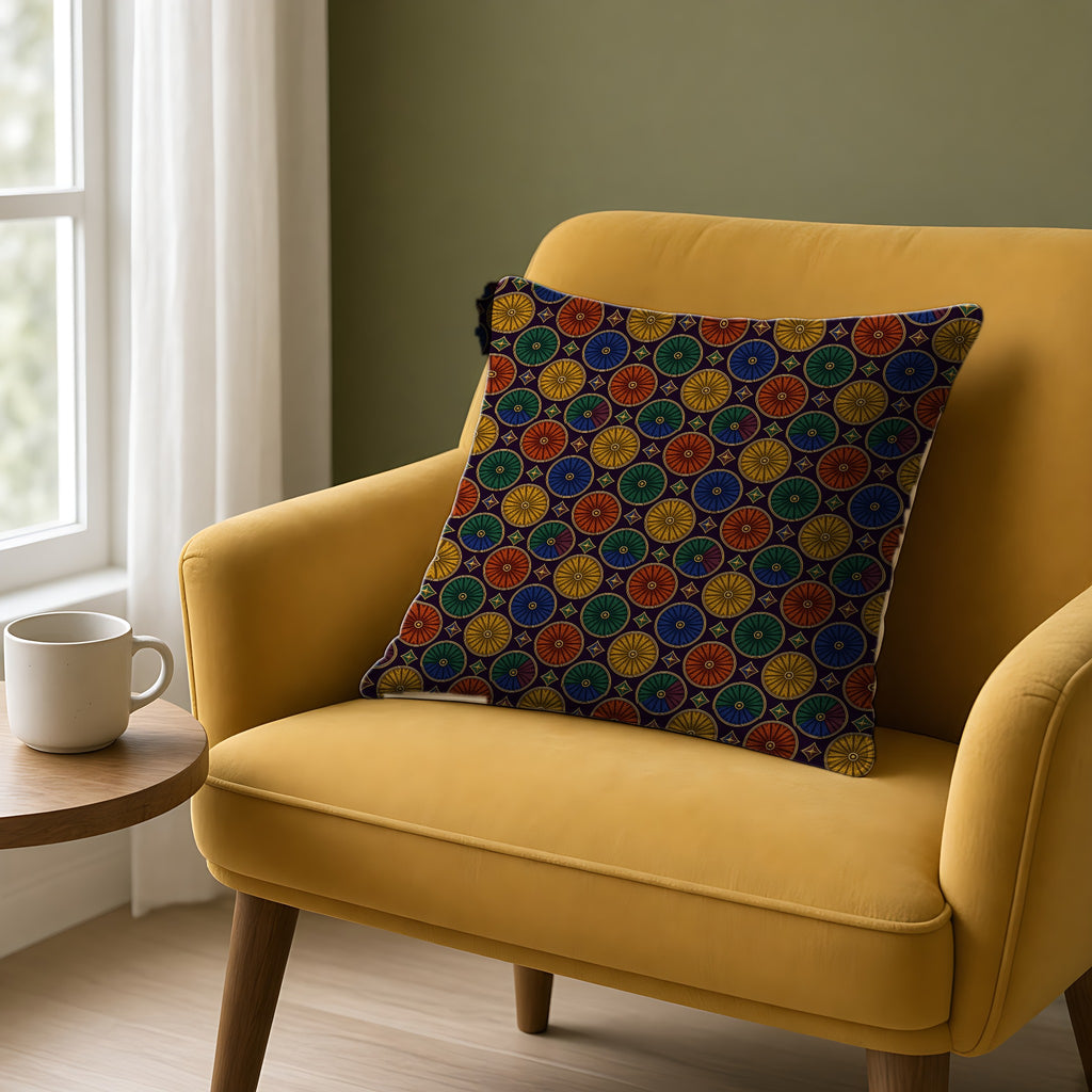 Enamel Parasol Medallions Faux Suede Cushion on a mustard armchair by a window