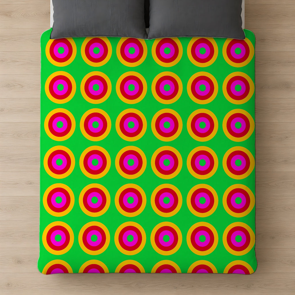 Giant Op-Art Jewel Rings Comforter on a bed, seen from above