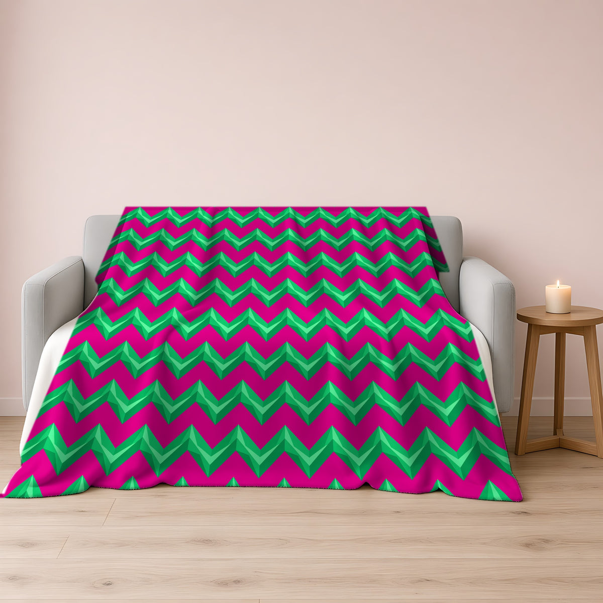 Broad Cut-Gem Chevrons Sherpa Fleece Blanket draped over a grey sofa