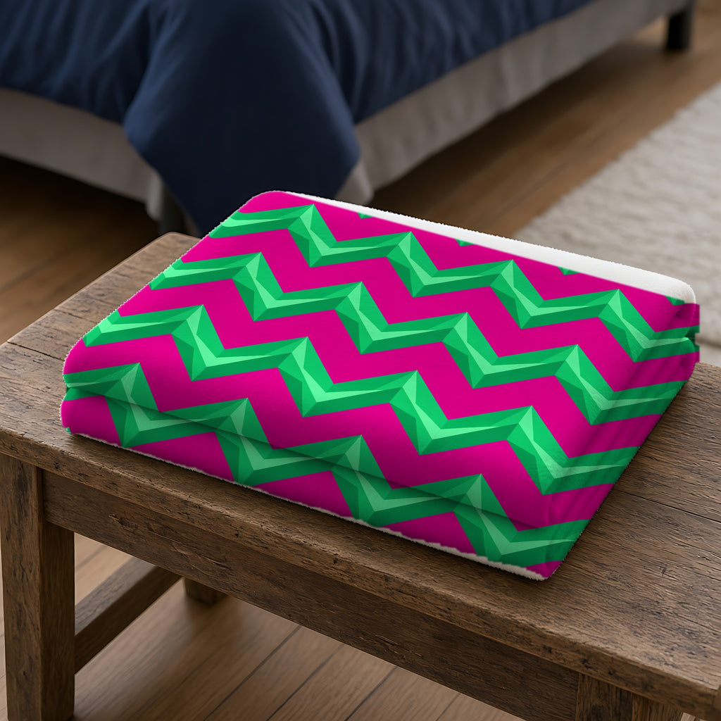 Broad Cut-Gem Chevrons Sherpa Fleece Blanket folded on a wooden bench