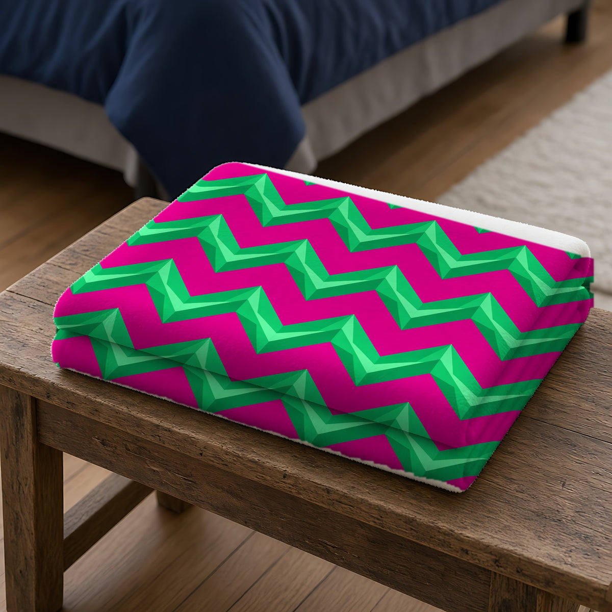 Broad Cut-Gem Chevrons Sherpa Fleece Blanket folded on a wooden bench
