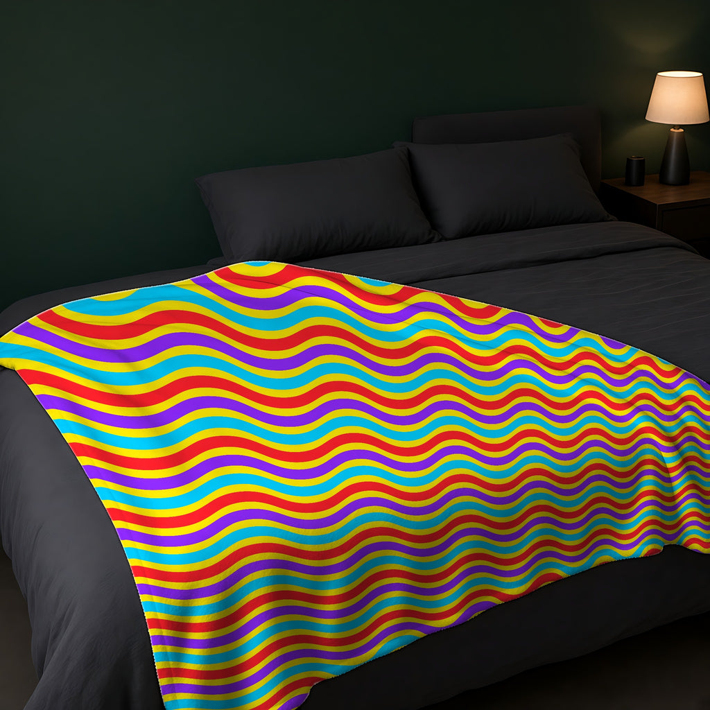 Wide Wave Interference Sherpa Fleece Blanket across the foot of a dark bed