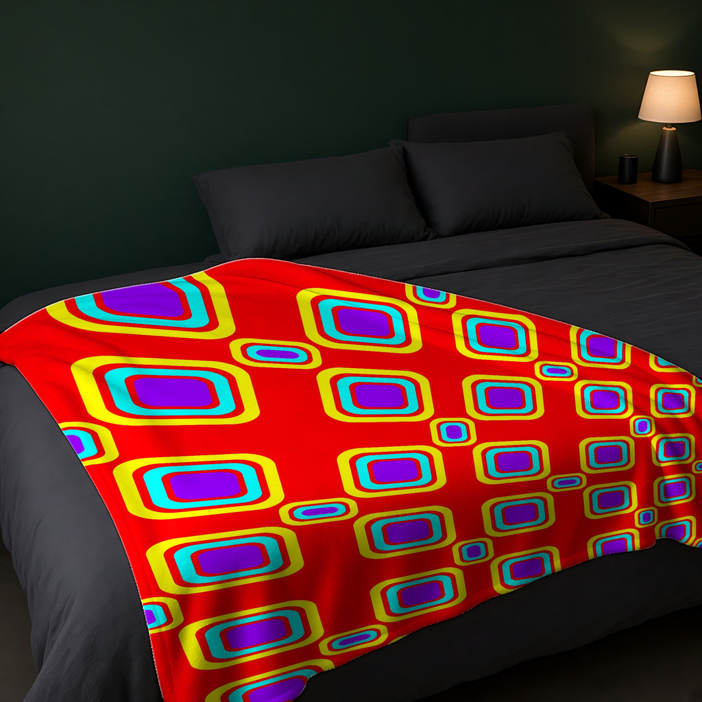 Big Ripple Squares Sherpa Fleece Blanket across the foot of a dark bed