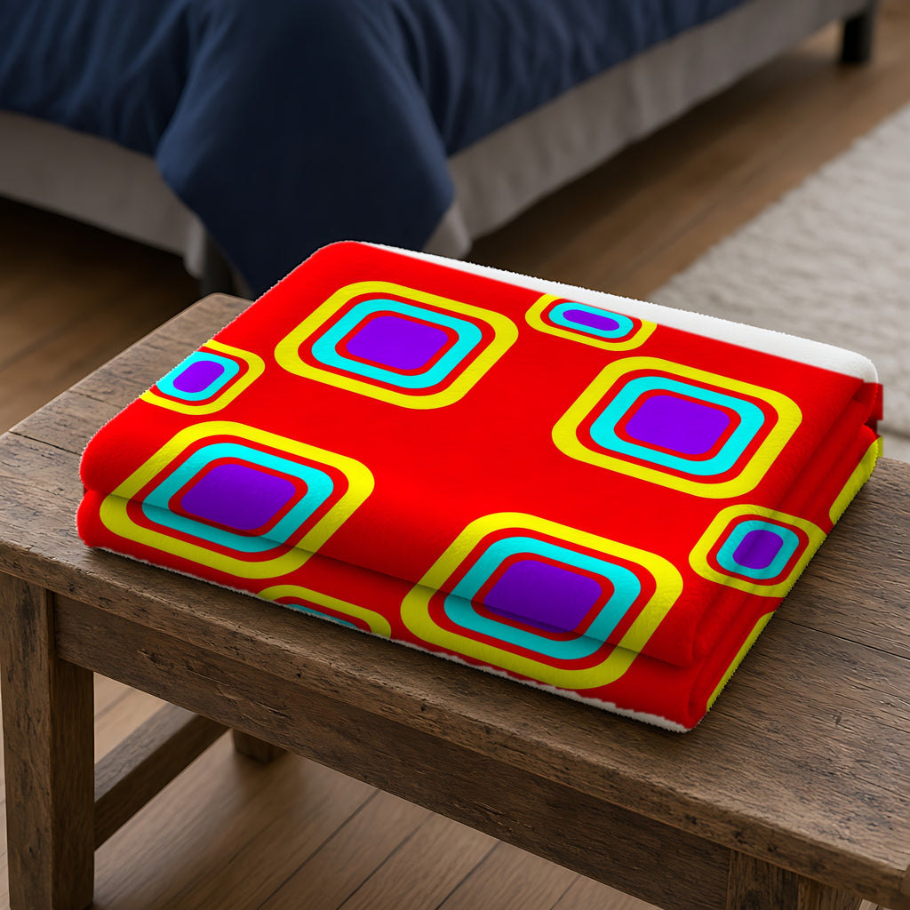Big Ripple Squares Sherpa Fleece Blanket folded on a wooden bench