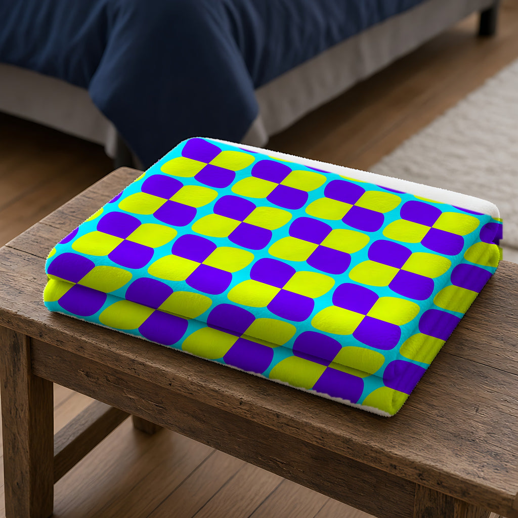Bold Bulge Checker Sherpa Fleece Blanket folded on a wooden bench