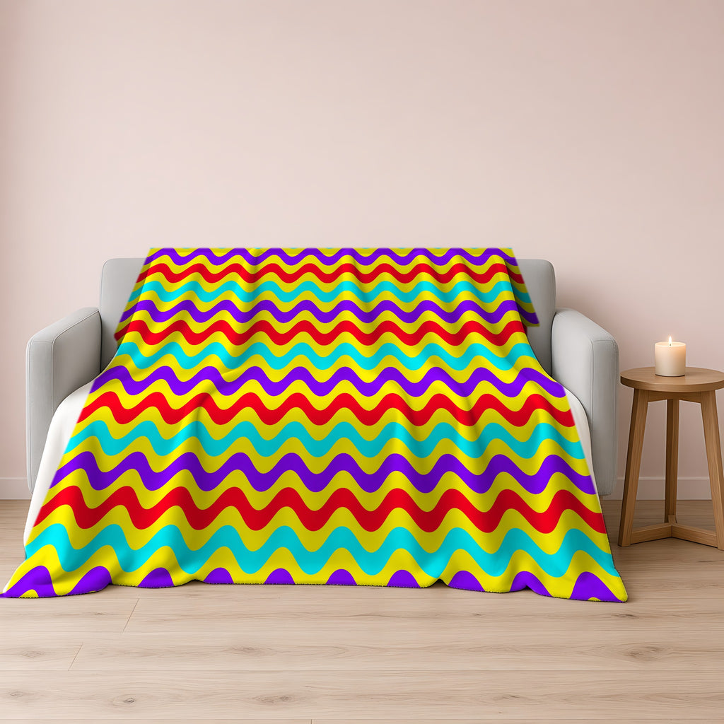 Big Ripple Chevrons Sherpa Fleece Blanket draped over a grey sofa