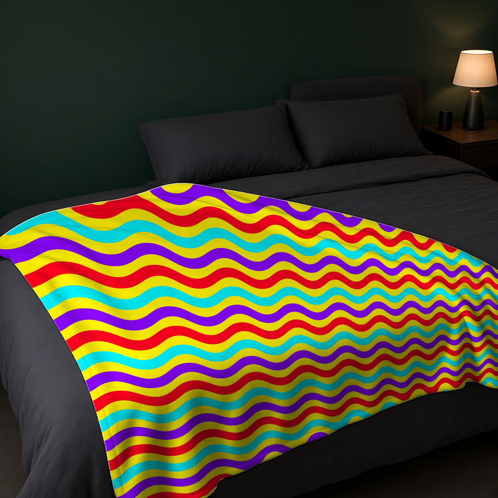 Big Ripple Chevrons Sherpa Fleece Blanket across the foot of a dark bed
