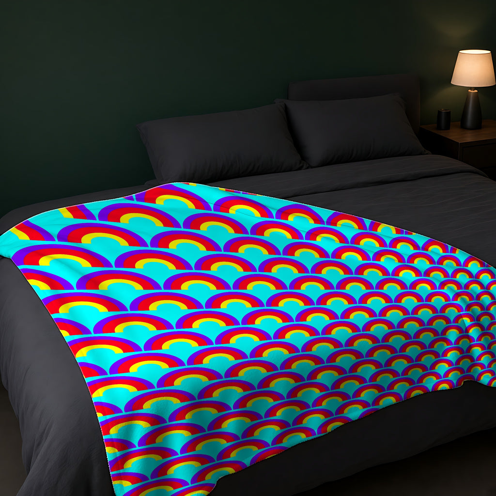 Chromatic Scallop Ripple Sherpa Fleece Blanket across the foot of a dark bed