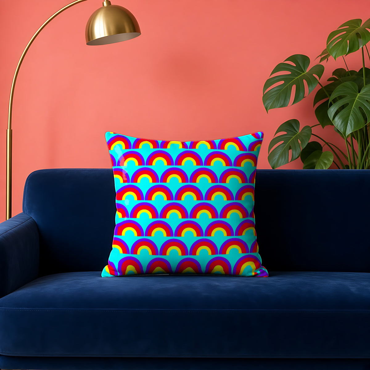 Chromatic Scallop Ripple faux suede cushion in the Chromatic Ripple palette, on a navy velvet sofa against a coral wall